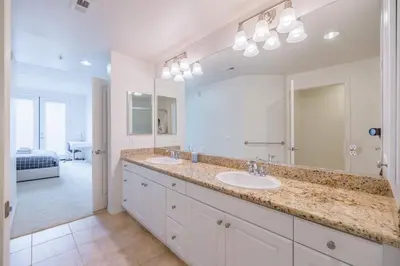 a bathroom with two sinks and a large mirror at Luxury Irvine Spectrum 2 bedrooms 2 Bathrooms Kitchen pool Apartment in Irvine