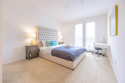 a bedroom with a bed and a desk and a sink at Luxury Irvine Spectrum 2 bedrooms 2 Bathrooms Kitchen pool Apartment in Irvine