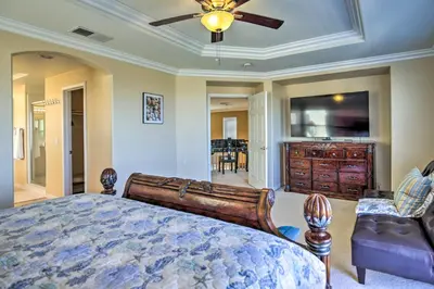 a bedroom with a bed and a ceiling fan at Luxury San Diego Home with Pool, Spa and Views! in San Diego