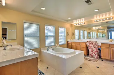a large bathroom with two sinks and a large mirror at Luxury San Diego Home with Pool, Spa and Views! in San Diego