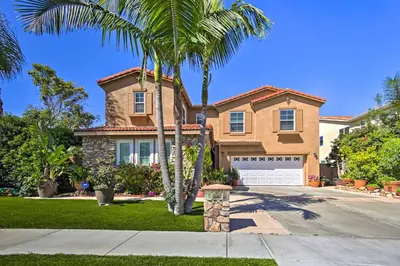 a house with a palm tree in front of a driveway at Luxury San Diego Home with Pool, Spa and Views! in San Diego