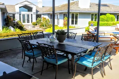 a black table and chairs on a patio at Luxury Modern Chateau near wineries & beaches in Fallbrook