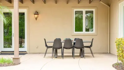 a table and chairs in front of a house at Secluded Estate Exclusive Views of Wine Country Private Home Theater Twilight Vines by AvantStay in Sage