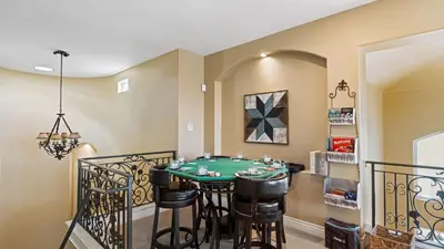 a dining room with a green table and chairs at Wine Country Villa • Large Rooftop Terrace w Views Game Room Via del Sur in Temecula