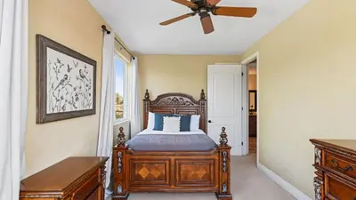 a bedroom with a bed and a ceiling fan at Wine Country Villa • Large Rooftop Terrace w Views Game Room Via del Sur in Temecula