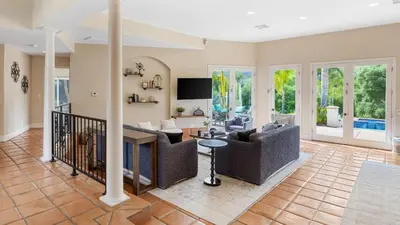 a living room with couches and a tv at Grapevine by AvantStay Secluded 5BR Villa 4 Acres of Vineyards Avo Groves in Temecula