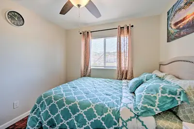 a bedroom with a bed and a window at Karaoke Fun, Hot Tub and Patio! San Diego Sanctuary in San Diego