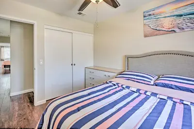 a bedroom with a bed and a ceiling fan at Karaoke Fun, Hot Tub and Patio! San Diego Sanctuary in San Diego