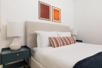 a bedroom with a bed and a lamp on a nightstand at Avalon 2 Unit Buyout II IV by AvantStay Mins to Gaslamp Patio w BQQ in San Diego