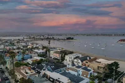 an aerial view of a city with boats in the water at Bay View I by AvantStay Stylish Mission Beach Home on the Sand in San Diego