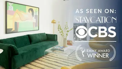 a living room with a green couch and a sign at Avalon Buyout by AvantStay Mins to Gaslamp Rooftop w BBQ Patio in San Diego