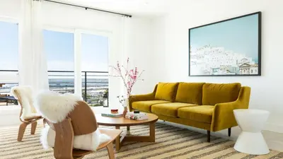 a living room with a yellow couch and a table at Avalon 2 Unit Buyout I III AvantStay Mins to GaslampBeautiful Deck w BBQ in San Diego