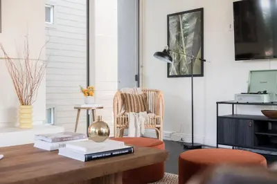 a living room with a coffee table and a chair at Balboa I by AvantStay - Stylish Condo Balboa Park Adjacent w Views in San Diego