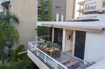 a balcony of a building with a table on it at Balboa I by AvantStay - Stylish Condo Balboa Park Adjacent w Views in San Diego