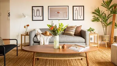 a living room with a couch and a table at Camden by AvantStay 5mins to the Beach Elevated Home w Pacific Ocean Views in Encinitas