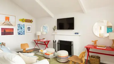 a living room with a couch and a fireplace at Hamilton I by AvantStay Beach House Rooftop Deck Newly Renovated Bungalow in San Diego