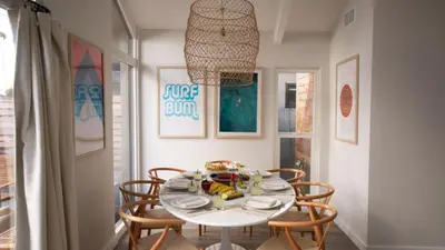 a dining room with a white table and chairs at 3 Blocks to Beach Private Pool Rooftop Patio Hamilton I II by AvantStay in San Diego