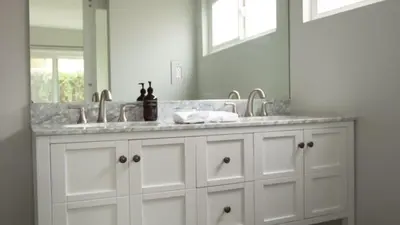 a bathroom with two sinks and a large mirror at 3 Blocks to Beach Private Pool Rooftop Patio Hamilton I II by AvantStay in San Diego