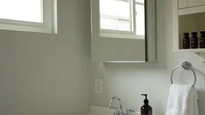 a white bathroom with a sink and a mirror at 3 Blocks to Beach Private Pool Rooftop Patio Hamilton I II by AvantStay in San Diego