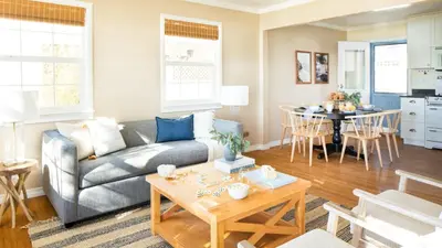 a living room with a couch and a table at Kokomo by AvantStay Bayside Getaway w Fire Pit Large Outdoor Patio in San Diego