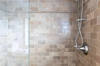 a bathroom with a shower with a glass door at Oliver by AvantStay Summer Escape Beach House 4 Blcks from Ocean in San Diego