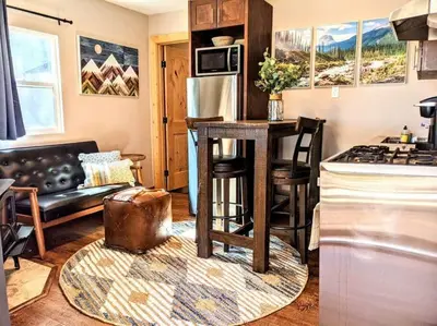 a kitchen with a counter and a stove top oven at #6 The Hawks Hideout Cabin in Santa Ysabel