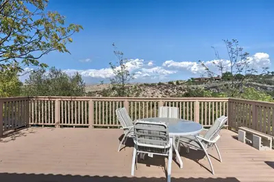 a patio with a table and chairs on a deck at Hilltop Hideaway in Temecula Wine Country in Sage