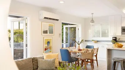 a kitchen and living room with a table and chairs at Mission Point Buyout by AvantStay Two Unit Buyout w Patio Fire Pit Close to Beach 6BDRs in San Diego