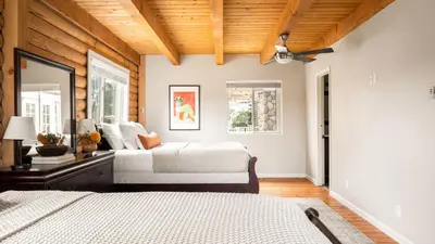 a bedroom with two beds and a wooden ceiling at Chateau Syrah by AvantStay Picturesque Estate w Pool Hot Tub Table Tennis Pool Table New Pickleball Court Basketball hoop in Temecula