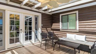a porch with chairs and a bench and windows at Chateau Syrah by AvantStay Picturesque Estate w Pool Hot Tub Table Tennis Pool Table New Pickleball Court Basketball hoop in Temecula