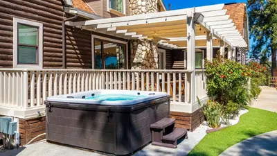 a hot tub in the backyard of a house at Chateau Syrah by AvantStay Picturesque Estate w Pool Hot Tub Table Tennis Pool Table New Pickleball Court Basketball hoop in Temecula