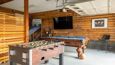 a room with a pool table and a tv at Chateau Syrah by AvantStay Picturesque Estate w Pool Hot Tub Table Tennis Pool Table New Pickleball Court Basketball hoop in Temecula