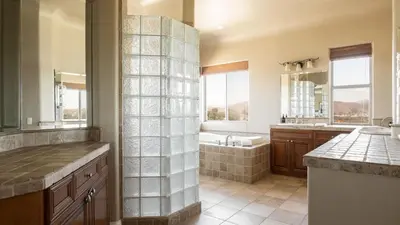 a large bathroom with a tub and a sink at Sangiovese By AvantStay Spectacular Estate w Pool Hot Tub Putting Green in Temecula