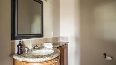 a bathroom with a sink and a mirror at Sangiovese By AvantStay Spectacular Estate w Pool Hot Tub Putting Green in Temecula