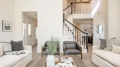 a living room with two white couches and a table at The Riesling Retreat by AvantStay Estate w Pool HotTub Putting Green Pickle Ball Court in Sage