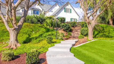 a house with a garden with a stairway at The Riesling Retreat by AvantStay Estate w Pool HotTub Putting Green Pickle Ball Court in Sage