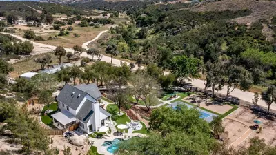 an aerial view of a house with a swimming pool at The Riesling Retreat by AvantStay Estate w Pool HotTub Putting Green Pickle Ball Court in Sage