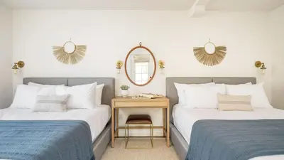 two beds sitting next to each other in a bedroom at The Riesling Retreat by AvantStay Estate w Pool HotTub Putting Green Pickle Ball Court in Sage