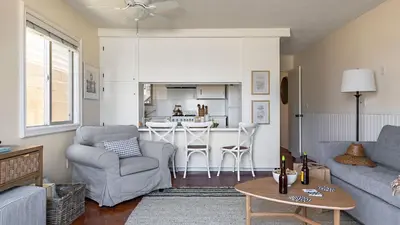 a living room with a couch and a table at Bay View II by AvantStay Ocean View Mission Beach Home on the Sand in San Diego