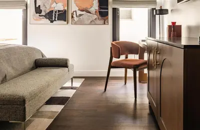 a living room with a couch and a chair at Orli La Jolla in San Diego