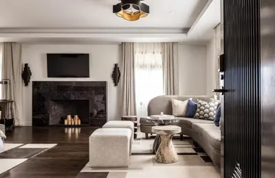 a living room with a couch and a fireplace at Orli La Jolla in San Diego