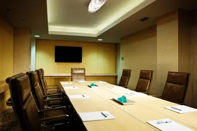 a conference room with a long table and chairs at Pier South Resort, Autograph Collection in Imperial Beach