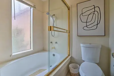 a bathroom with a tub and a toilet and a shower at Borrego Springs Retreat with Grill and Patio! in Borrego Springs