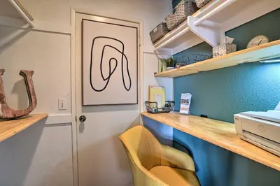 a small kitchen with a counter and a desk at Borrego Springs Retreat with Grill and Patio! in Borrego Springs