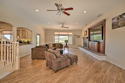 a living room with two couches and a ceiling fan at Luxe Vista Getaway with Private Pool and Hot Tub! in Vista
