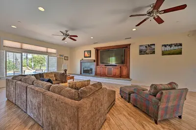 a living room with two couches and a flat screen tv at Luxe Vista Getaway with Private Pool and Hot Tub! in Vista