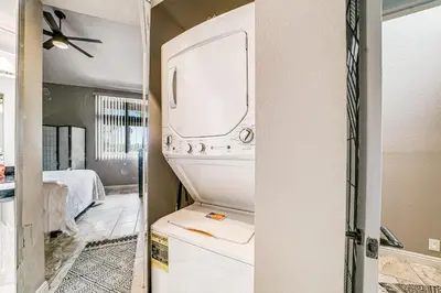 a white refrigerator with a sink and a mirror at Whitewater Village Charm in Oceanside