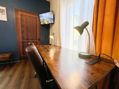 an office with a wooden desk with a lamp at ITH San Diego Mission Beach Backpacker Hostel in San Diego