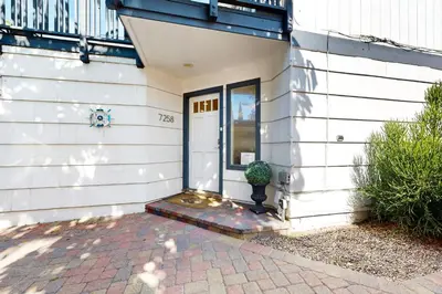 a front door of a house with a potted plant at La Jolla Beach Retreat in San Diego