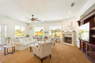 a living room with white furniture and a fireplace at Gaia Inn & Spa- Adult Only- Temecula Wine Country in Temecula